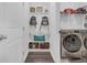 Convenient laundry room with washer, dryer, and built-in storage at 2000 Musgrove Mill Way, Myrtle Beach, SC 29579