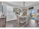 Charming dining room with a round table and access to a patio at 2000 Musgrove Mill Way, Myrtle Beach, SC 29579