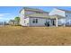 Large backyard with patio and home exterior view at 2000 Musgrove Mill Way, Myrtle Beach, SC 29579