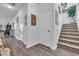 Elegant hallway with hardwood floors and tasteful wall art at 2000 Musgrove Mill Way, Myrtle Beach, SC 29579
