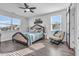 Relaxing main bedroom with a ceiling fan and large windows at 2000 Musgrove Mill Way, Myrtle Beach, SC 29579