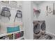 Bright laundry room featuring ample shelving and a built-in bench at 2000 Musgrove Mill Way, Myrtle Beach, SC 29579