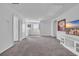Bright bonus room with gray carpeting and built-in entertainment center at 2000 Musgrove Mill Way, Myrtle Beach, SC 29579