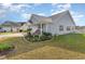 House exterior with landscaped garden and driveway at 1525 Sunmeadow Dr., Conway, SC 29526