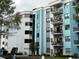 Multi-story building with light blue and white exterior at 5001 Little River Rd. # E115, Myrtle Beach, SC 29577