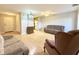 Living room with furniture and view into kitchen at 5001 Little River Rd. # E115, Myrtle Beach, SC 29577