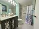 Updated bathroom with walk-in shower, new vanity, and modern fixtures at 5001 Little River Rd. # E115, Myrtle Beach, SC 29577