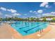 Community pool with plenty of lounge chairs and umbrellas at 1426 Peterson St., Myrtle Beach, SC 29577