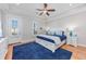 Main bedroom with king-size bed, access to private balcony, and ceiling fan at 1426 Peterson St., Myrtle Beach, SC 29577