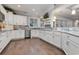 Modern kitchen with white cabinets, granite counters, and stainless steel appliances at 4402 Boxwood St., Myrtle Beach, SC 29577