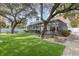 Landscaped backyard oasis with artificial turf and pool access at 4402 Boxwood St., Myrtle Beach, SC 29577