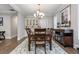Formal dining room features a large table and sideboard at 4402 Boxwood St., Myrtle Beach, SC 29577