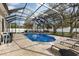 Relaxing screened-in pool and spa with lounge chairs at 4402 Boxwood St., Myrtle Beach, SC 29577