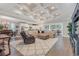 Spacious living room with high ceilings, hardwood floors and cozy seating at 4402 Boxwood St., Myrtle Beach, SC 29577