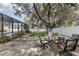 Relaxing backyard with firepit and seating area under shade trees at 4402 Boxwood St., Myrtle Beach, SC 29577