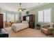 Spacious bedroom with ample natural light and built-in wooden cabinetry at 1026 Nittany Ct., Murrells Inlet, SC 29576