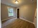 Bright bedroom with wood-look floors and a window at 23 Gabe Pl., Pawleys Island, SC 29585