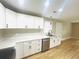 Modern kitchen with white shaker cabinets and stainless steel appliances at 23 Gabe Pl., Pawleys Island, SC 29585