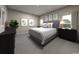 Spacious main bedroom with a king-size bed and plenty of room for furniture at 1213 Glenrose Ct Nw, Calabash, NC 28467