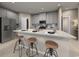 Modern kitchen with island and light gray cabinets at 1213 Glenrose Ct Nw, Calabash, NC 28467