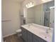 Double vanity bathroom with a large mirror and a walk-in shower at 511 Grain Field Dr., Georgetown, SC 29440