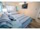 Bedroom with two twin beds, a TV, and a window offering natural light at 4800 S Ocean Blvd. # 1522, North Myrtle Beach, SC 29582