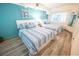 Bedroom with twin beds, coastal decor, and light wood floors at 4800 S Ocean Blvd. # 1522, North Myrtle Beach, SC 29582