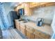 Compact kitchen with granite countertops and modern appliances at 4800 S Ocean Blvd. # 1522, North Myrtle Beach, SC 29582