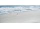 Aerial view of tranquil beach with single person at 4800 S Ocean Blvd. # 1522, North Myrtle Beach, SC 29582
