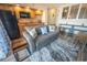 Living room with sofa and view into the kitchen at 4800 S Ocean Blvd. # 1522, North Myrtle Beach, SC 29582