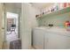 Laundry room with washer, dryer, and shelving at 206 56Th Ave. N, North Myrtle Beach, SC 29582