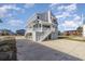 Two-story home with gray siding, elevated design and a spacious driveway at 206 56Th Ave. N, North Myrtle Beach, SC 29582