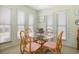 Bright dining area with glass table and four chairs, perfect for meals at 206 56Th Ave. N, North Myrtle Beach, SC 29582