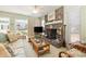 Cozy living room with fireplace, TV, and floral sofa at 206 56Th Ave. N, North Myrtle Beach, SC 29582