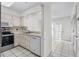 Efficient kitchen with white cabinets and appliances at 2925 Carriage Row Ln. # 134, Myrtle Beach, SC 29577