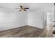 Simple living room with laminate floors and ceiling fan at 2925 Carriage Row Ln. # 134, Myrtle Beach, SC 29577