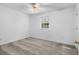 Simple bedroom with neutral carpet, ceiling fan, and large window at 2925 Carriage Row Ln. # 134, Myrtle Beach, SC 29577
