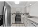 Clean and functional kitchen, equipped with microwave, oven, dishwasher, and refrigerator at 2925 Carriage Row Ln. # 134, Myrtle Beach, SC 29577