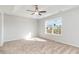 Well-lit bedroom with carpeted floor and large window at 1006 Stump Rd., Conway, SC 29526