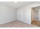 Spacious bedroom featuring carpet, double doors to closet, and access to another room at 1006 Stump Rd., Conway, SC 29526