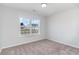 Bright bedroom with neutral walls, carpet, and a large window at 1006 Stump Rd., Conway, SC 29526