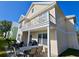 Back exterior view of two story house with balcony and patio at 101 Georges Bay Rd., Surfside Beach, SC 29575