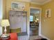 Entryway with bench, coat hooks and view of living room at 101 Georges Bay Rd., Surfside Beach, SC 29575