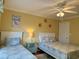 Bright guest bedroom with two twin beds, nightstand, and beach decor at 101 Georges Bay Rd., Surfside Beach, SC 29575