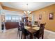 Open concept dining area with ocean view and wooden table at 2709 Ocean Blvd. S # 1202, Myrtle Beach, SC 29577