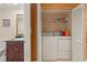 Bright laundry room with washer and dryer, and shelving for storage at 2709 Ocean Blvd. S # 1202, Myrtle Beach, SC 29577