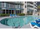 Resort-style pool with ample lounge chairs at 2709 Ocean Blvd. S # 1202, Myrtle Beach, SC 29577