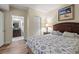 Bedroom with queen bed, ensuite bathroom access, and ocean view at 2709 Ocean Blvd. S # 1202, Myrtle Beach, SC 29577