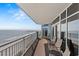 Spacious balcony overlooking ocean with seating for lounging and enjoying the view at 2709 Ocean Blvd. S # 1202, Myrtle Beach, SC 29577