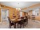 Dining room with six chairs and a large table, located near kitchen and bathroom at 2709 Ocean Blvd. S # 1202, Myrtle Beach, SC 29577